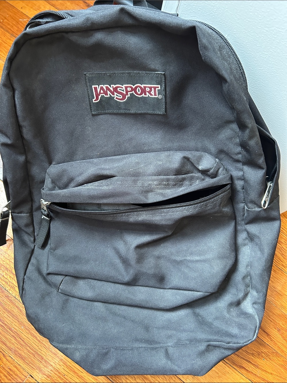 Jansport Black Backpack with Front Zip Pocket